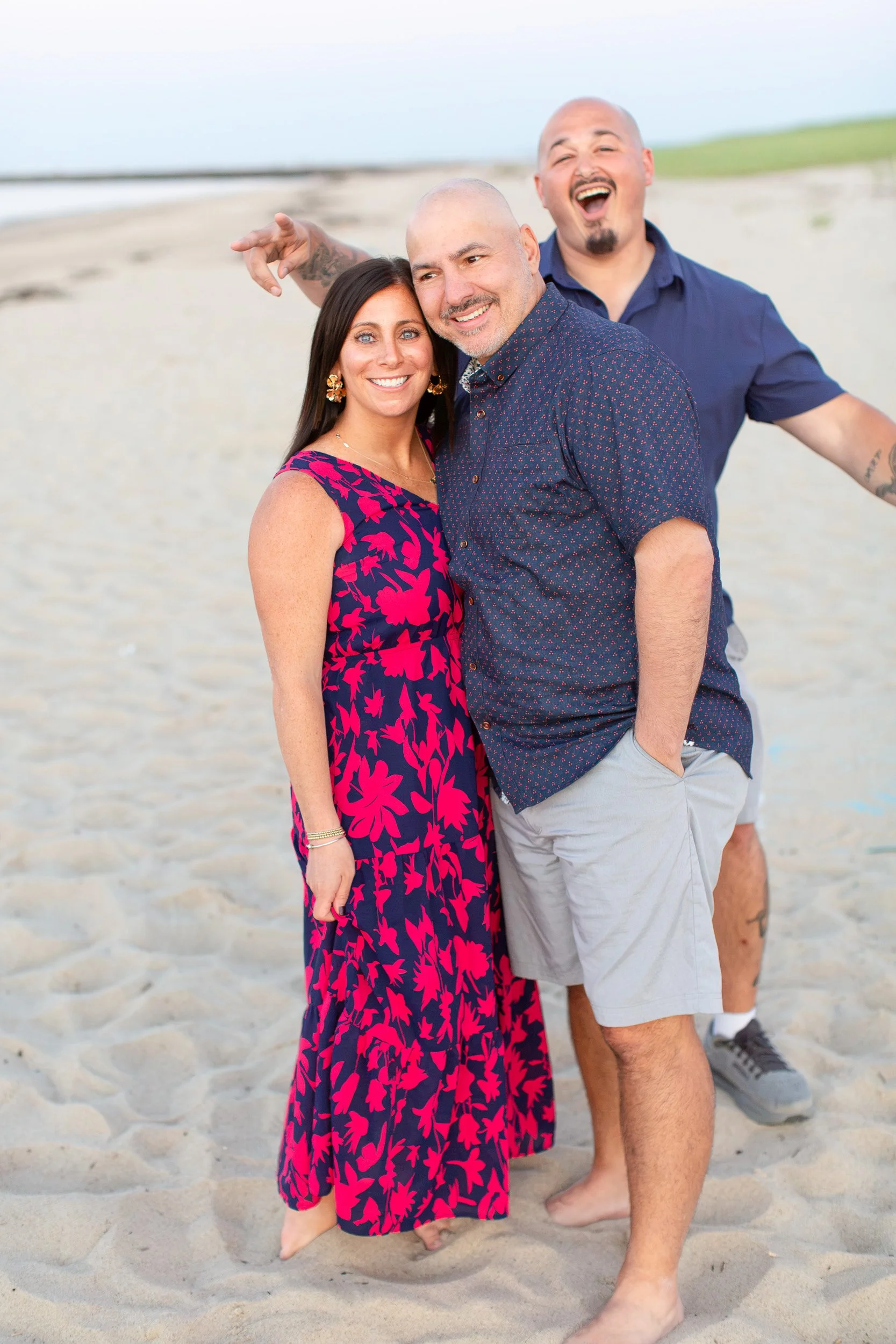 Family sharing a playful moment during their Scusset Beach photo session.
