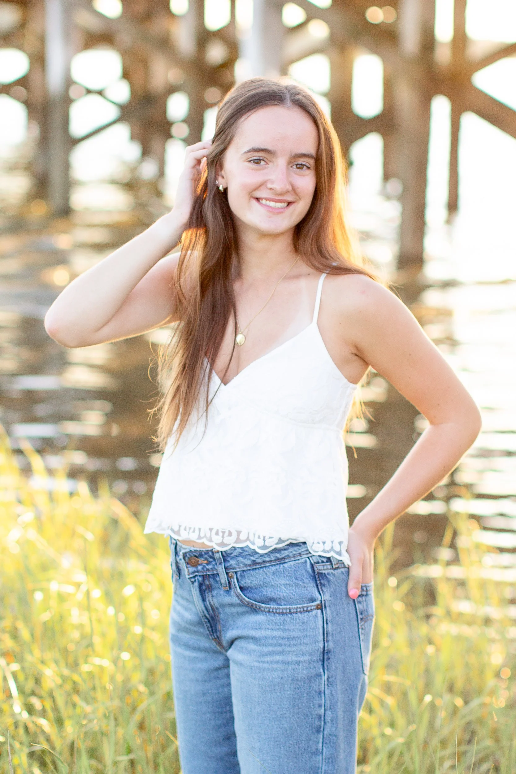 Natural senior portrait at Duxbury Beach in Massachusetts