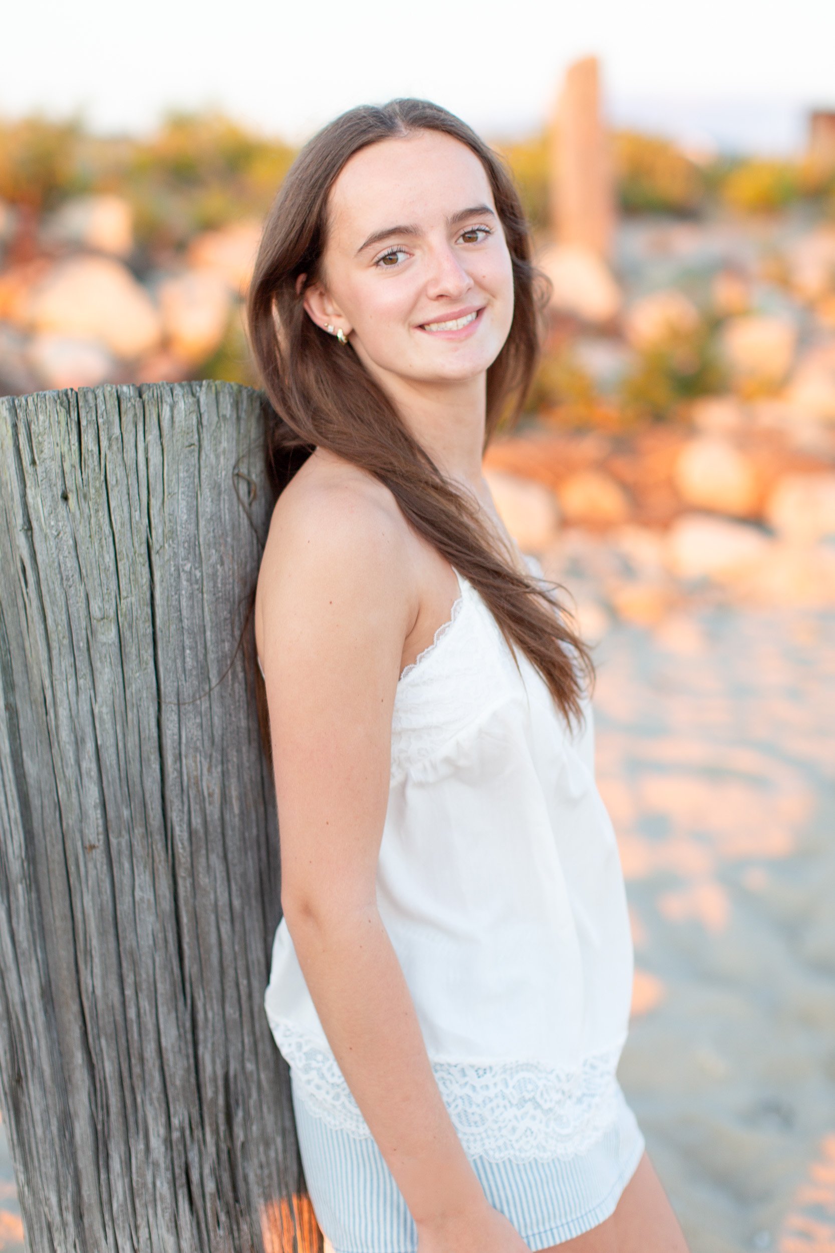 High school senior posing at Duxbury Beach
