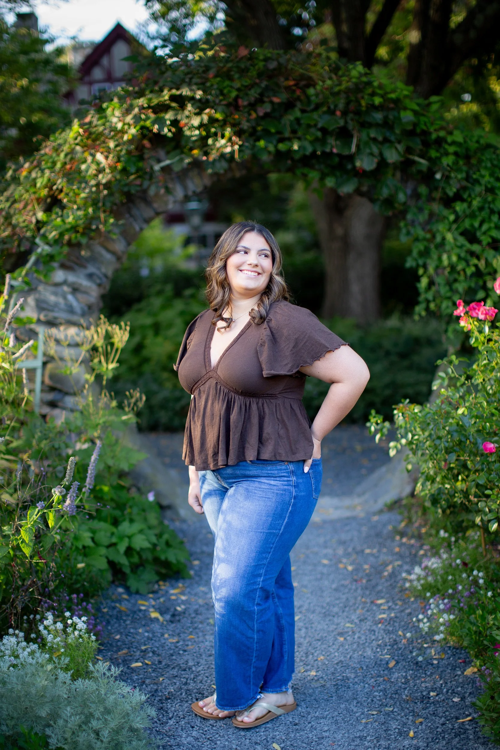 Mansfield MA senior portrait surrounded by colorful flowers at Blithewold Mansion and Gardens