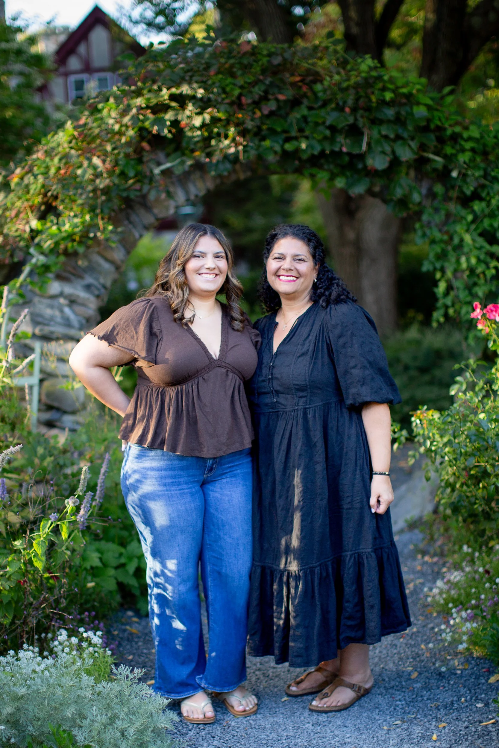 Senior with mom surrounded by colorful flowers at Blithewold Mansion and Gardens