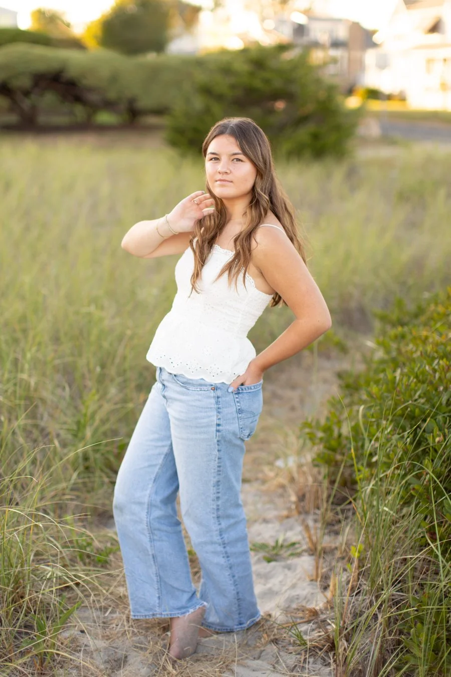 Senior photo session at Scarborough Beach in Narragansett during summer sunset
