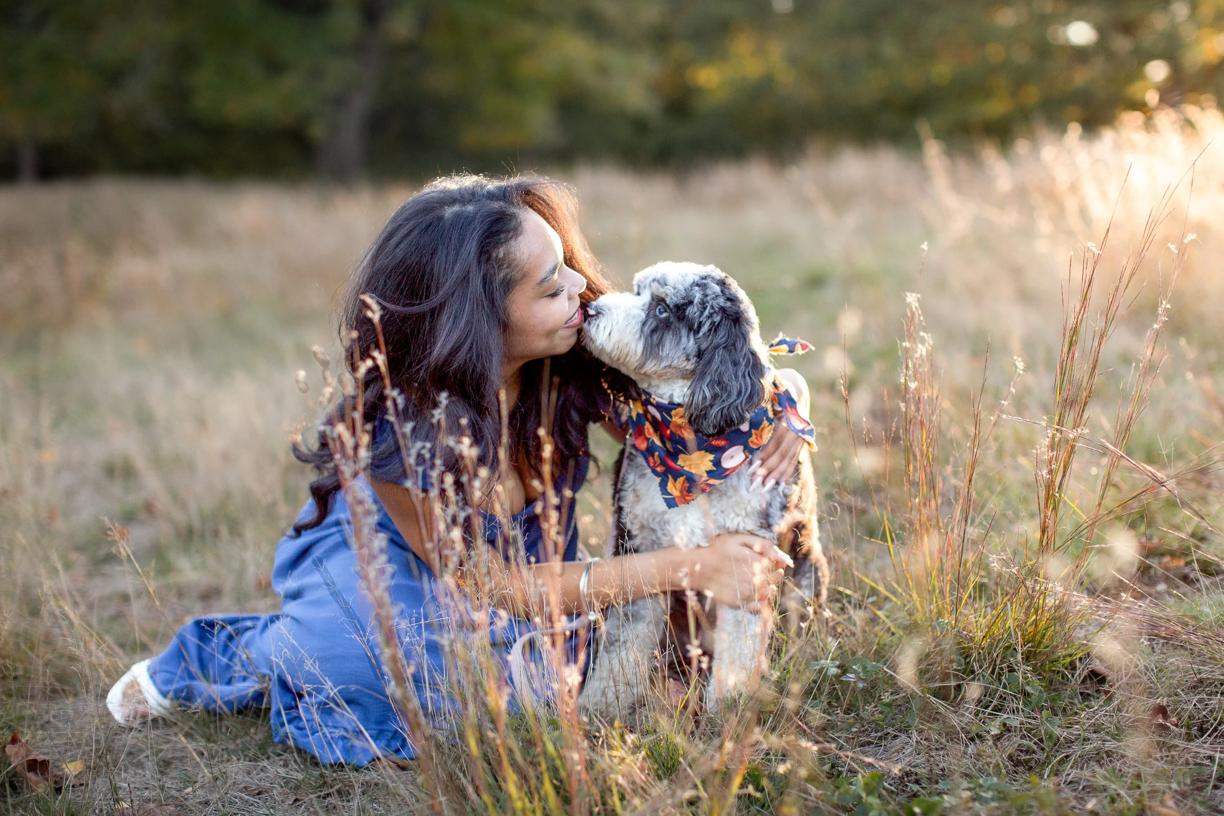 Maya posing with her dog Willow during her senior photo session at Bird Park.