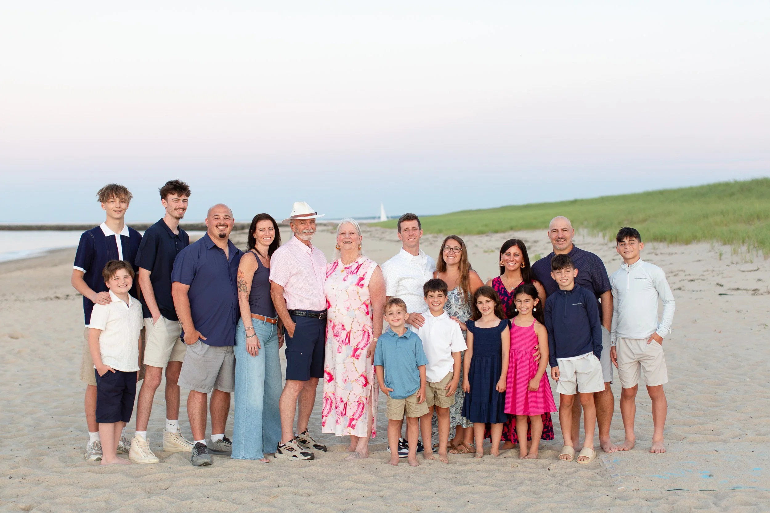 Extended family gathered together on the beach at Scusset Beach in Sandwich, MA.