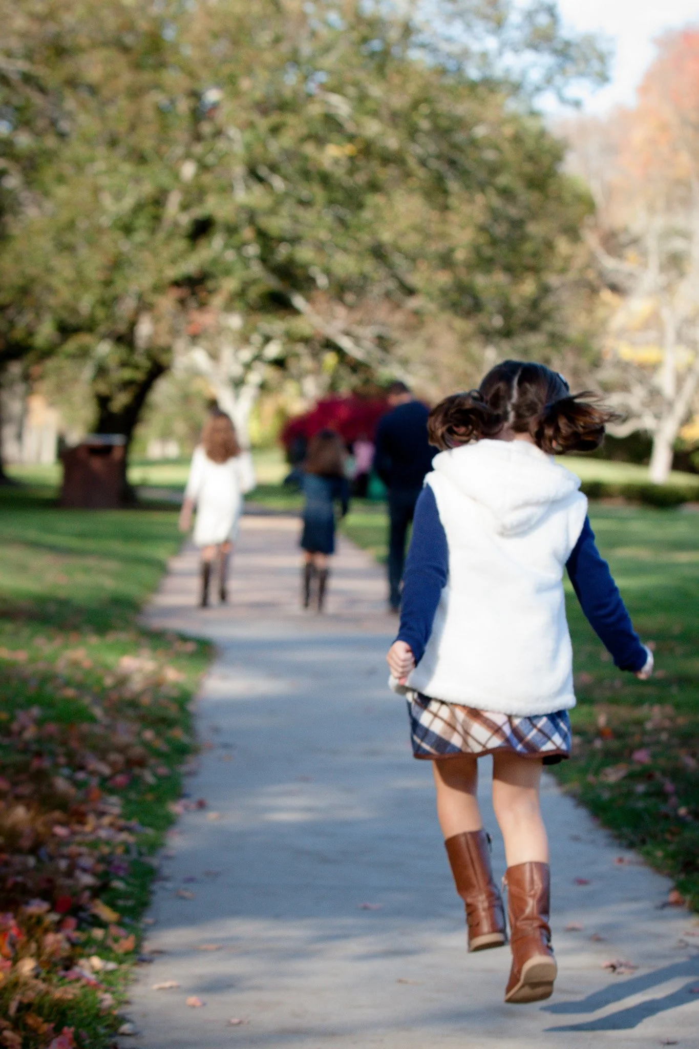 Daughter skippinng outdoors captured by a Mansfield MA family photographer