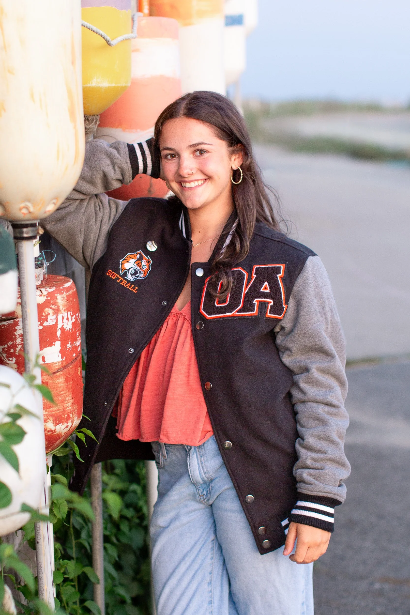 Natural senior portrait of an Oliver Ames High School senior smiling at Duxbury Beach.