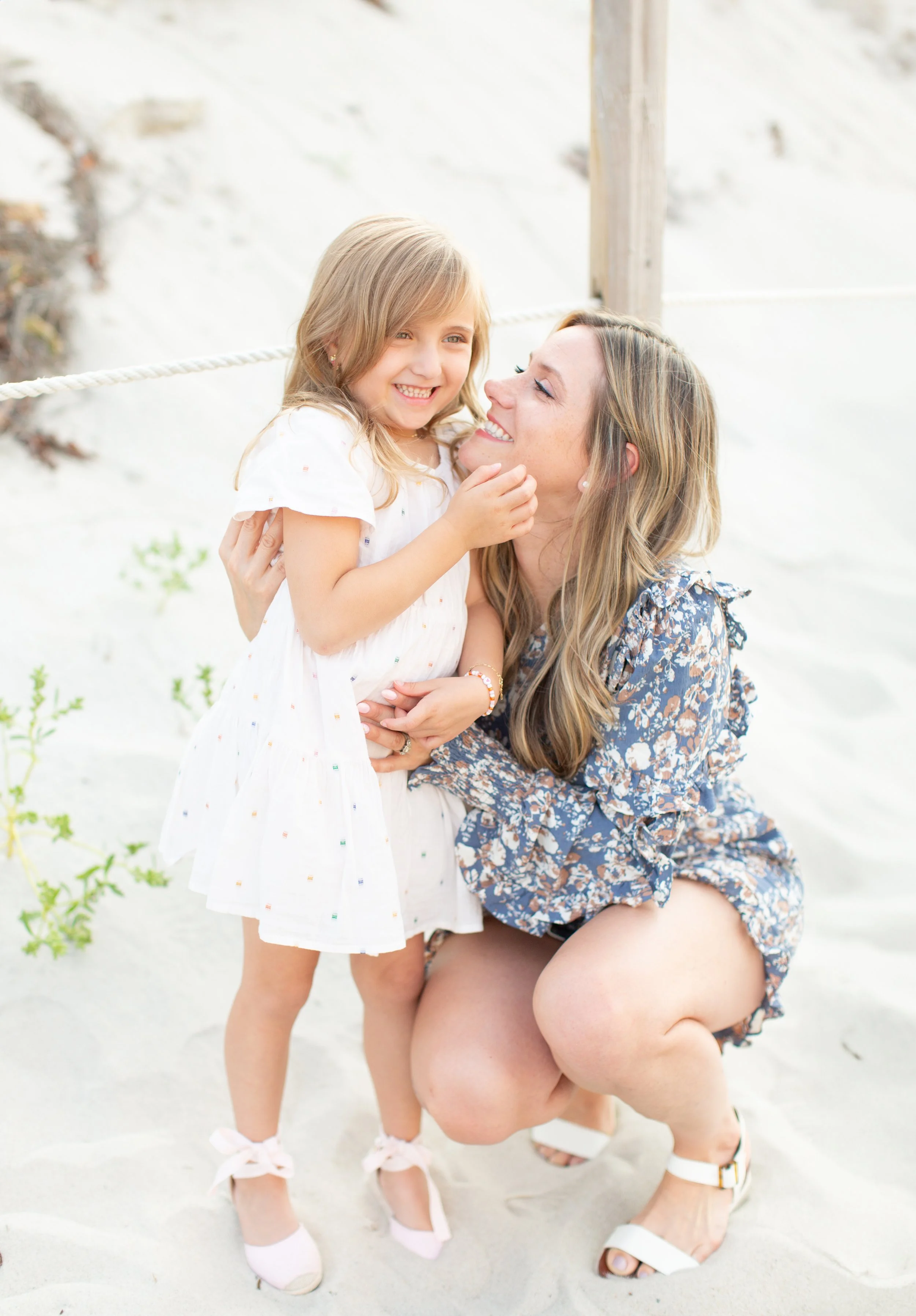 Family photography session for an Attleboro MA family photographed at Mayflower Beach on Cape Cod by Courtney Wager, capturing candid connection and coastal scenery.