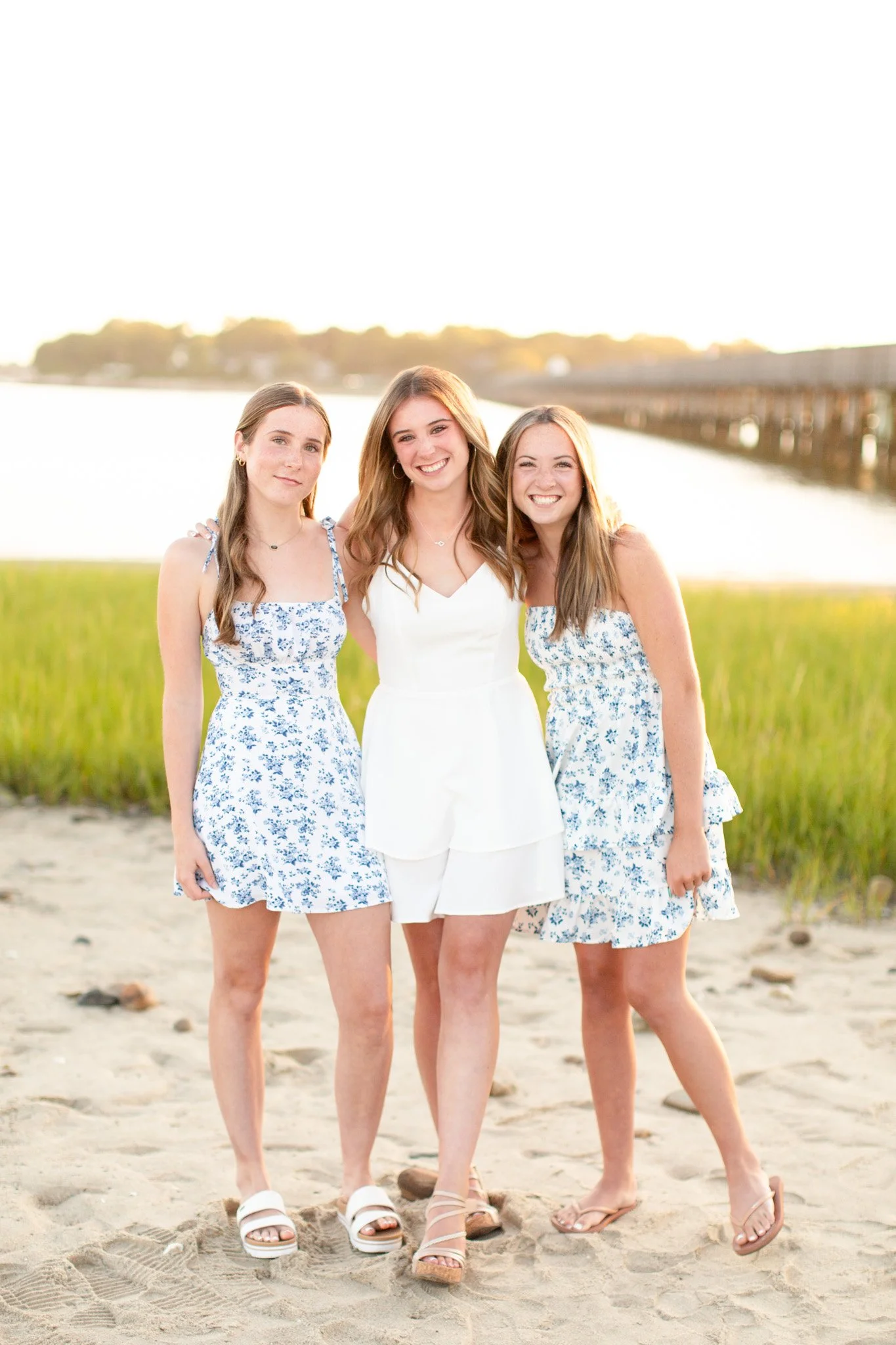 Sisters photographed together during a family mini session at Duxbury Beach in Massachusetts.