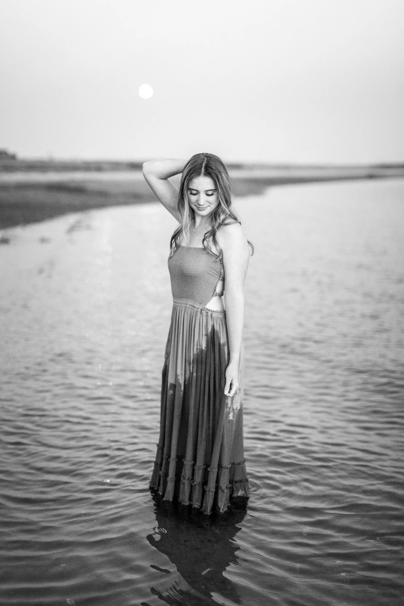 Mansfield MA senior photo session held at Duxbury Beach featuring a flowing dress during golden hour.