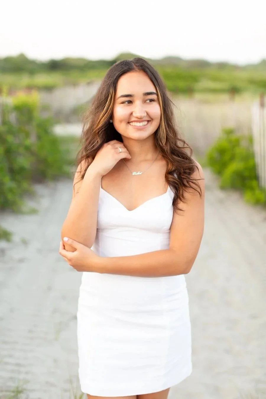 Senior photos for a Mansfield MA high school senior taken at Scarborough Beach in Narragansett RI by senior photographer Courtney Wager, featuring natural coastal light and relaxed posing.