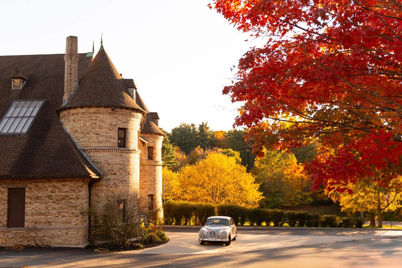 Vintage Jaguar Mark 2 saloon in front of Larz Anderson Auto Museum, captured by a Brookline family photographer.