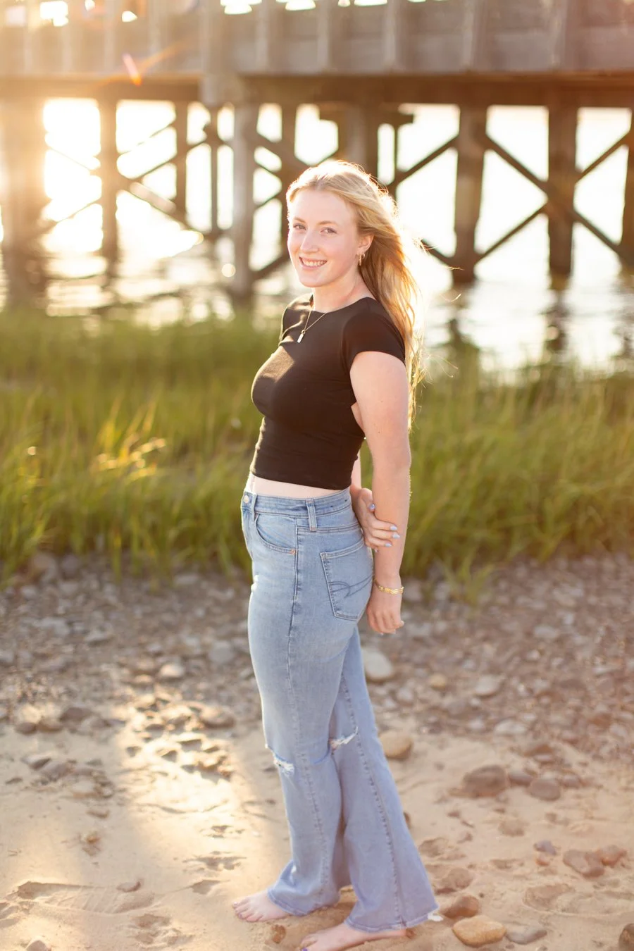 Senior girl beach photos taken at Duxbury Beach Bridge in MA