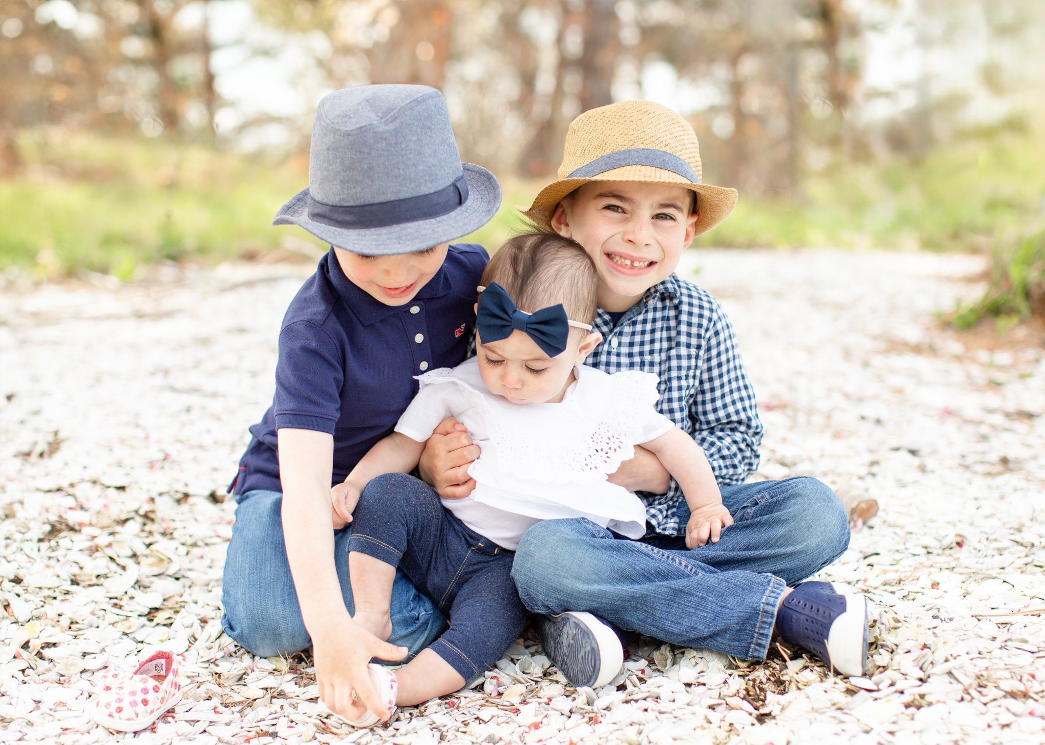 Natural family photography moment showing connection and emotion between siblings on Cape Cod