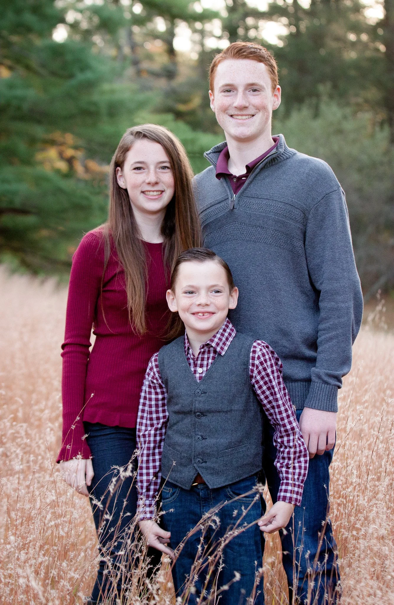 Family portrait with colorful fall foliage at Bird Park in Walpole