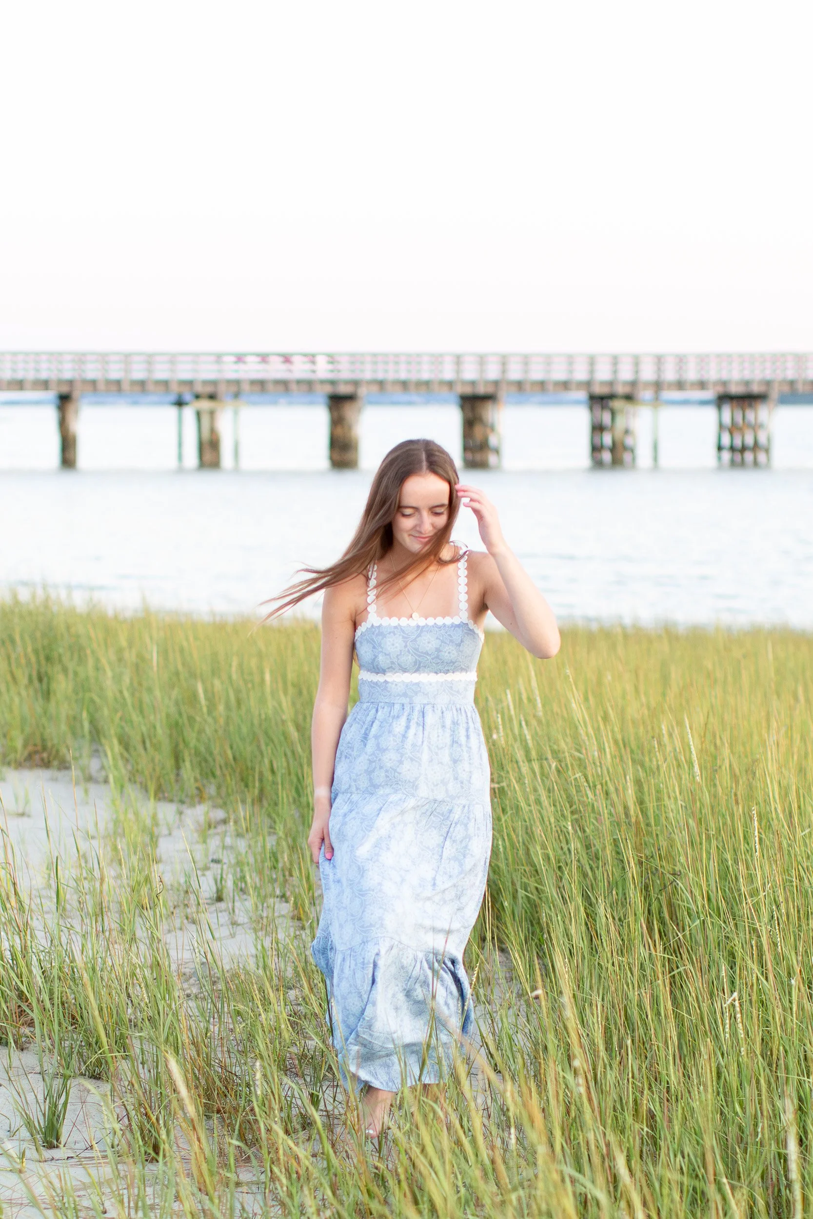 High school senior photographed during sunset at Duxbury Beach