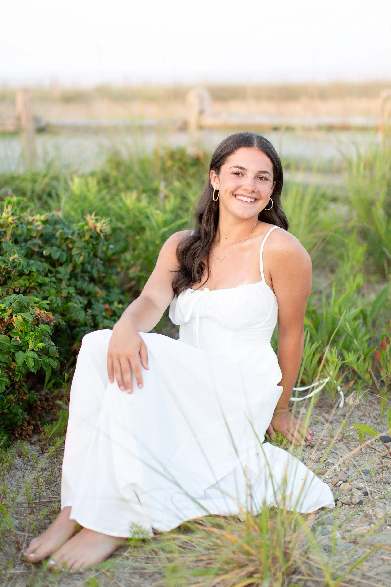 Relaxed senior photo of Logan during her Easton senior portrait session at Duxbury Beach.