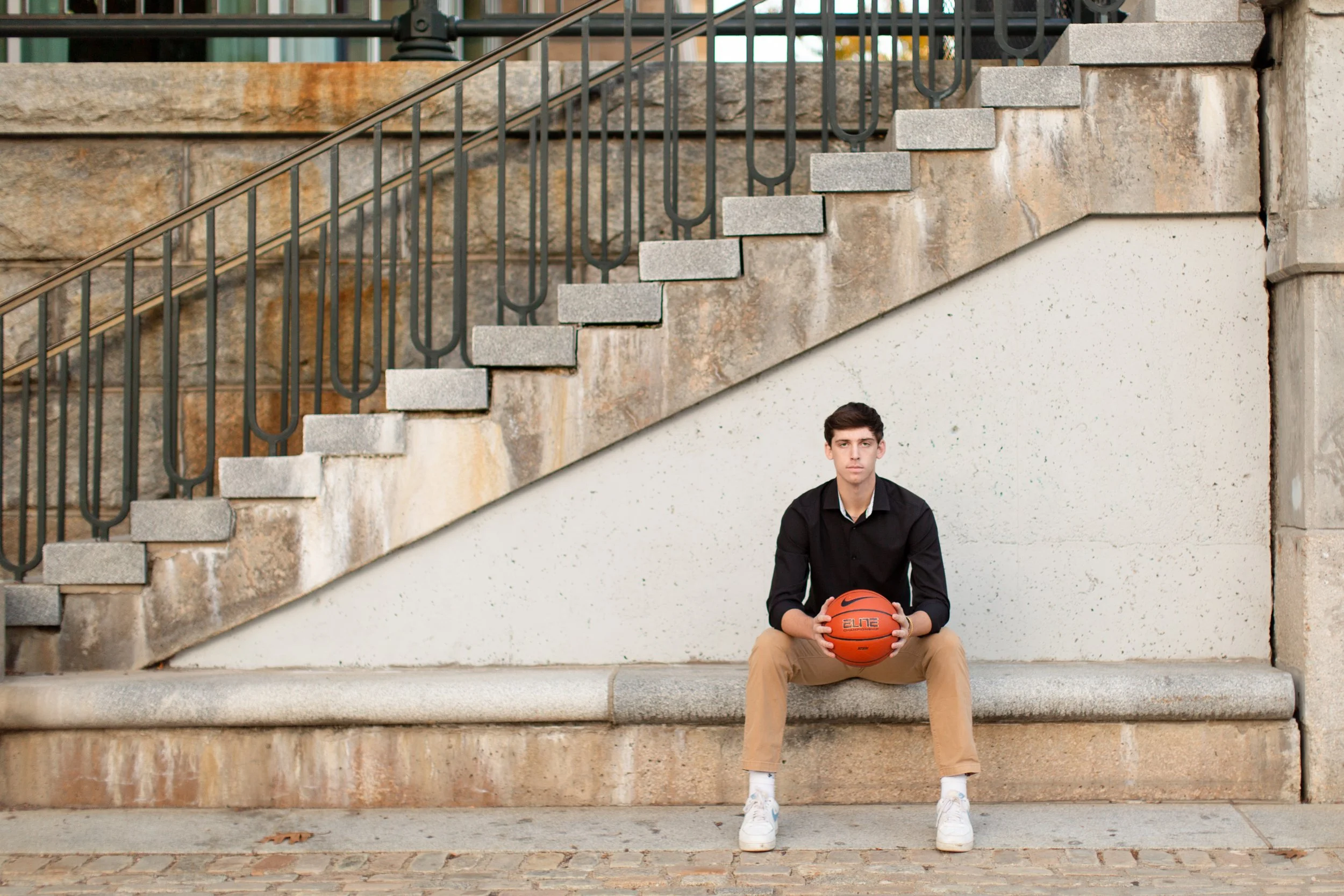 Guided senior photography session helping a senior boy feel at ease on camera