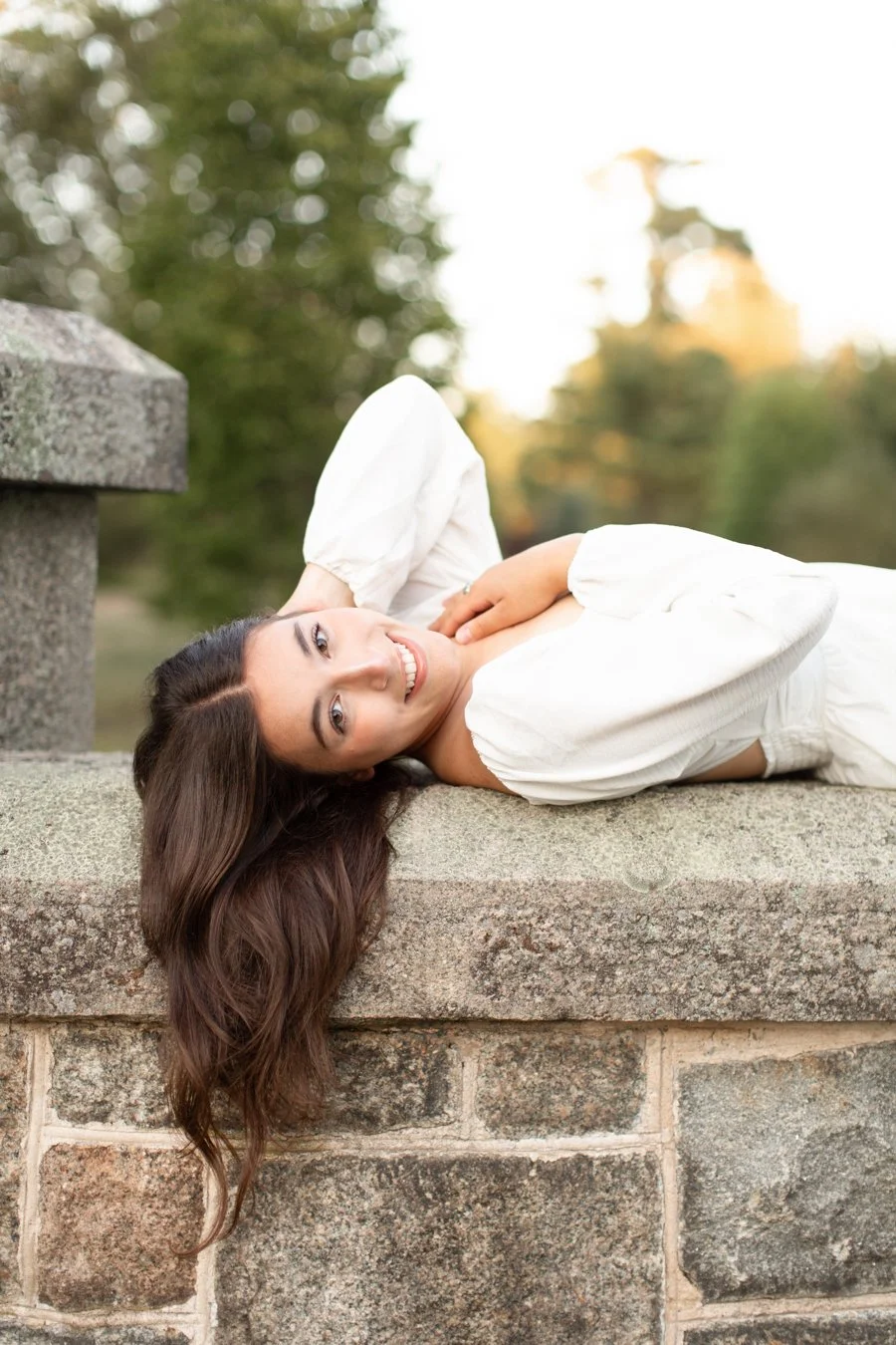 Senior portrait session for a Mansfield MA senior photographed at the Oliver Ames Estate in Easton MA by senior photographer Courtney Wager, featuring an elegant outdoor estate setting.