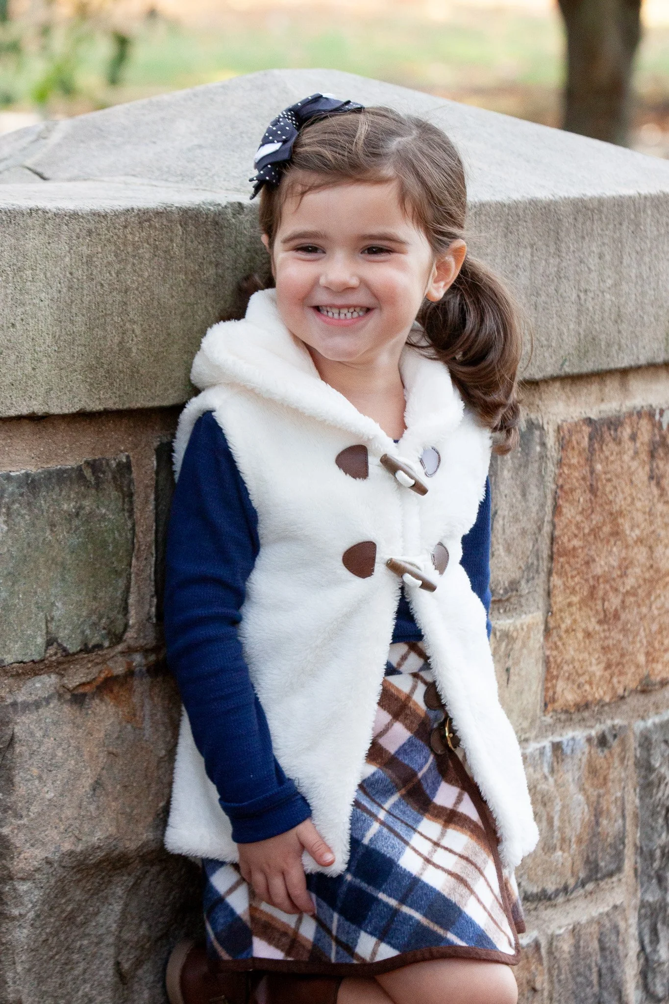 Girl laughing naturally during a relaxed family session in Walpole Massachusetts