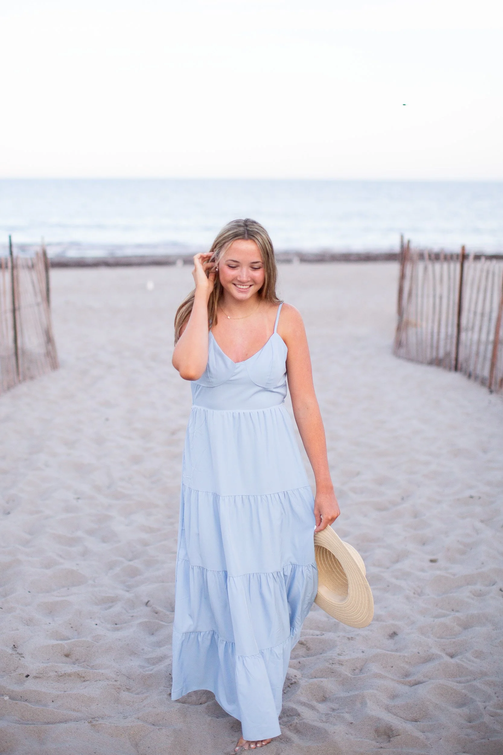 Senior portraits at Scarborough Beach in Narragansett, RI during sunset