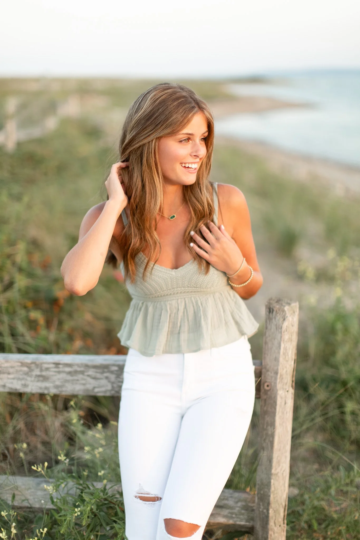 Close-up senior photo of Lily at Duxbury Beach with natural light