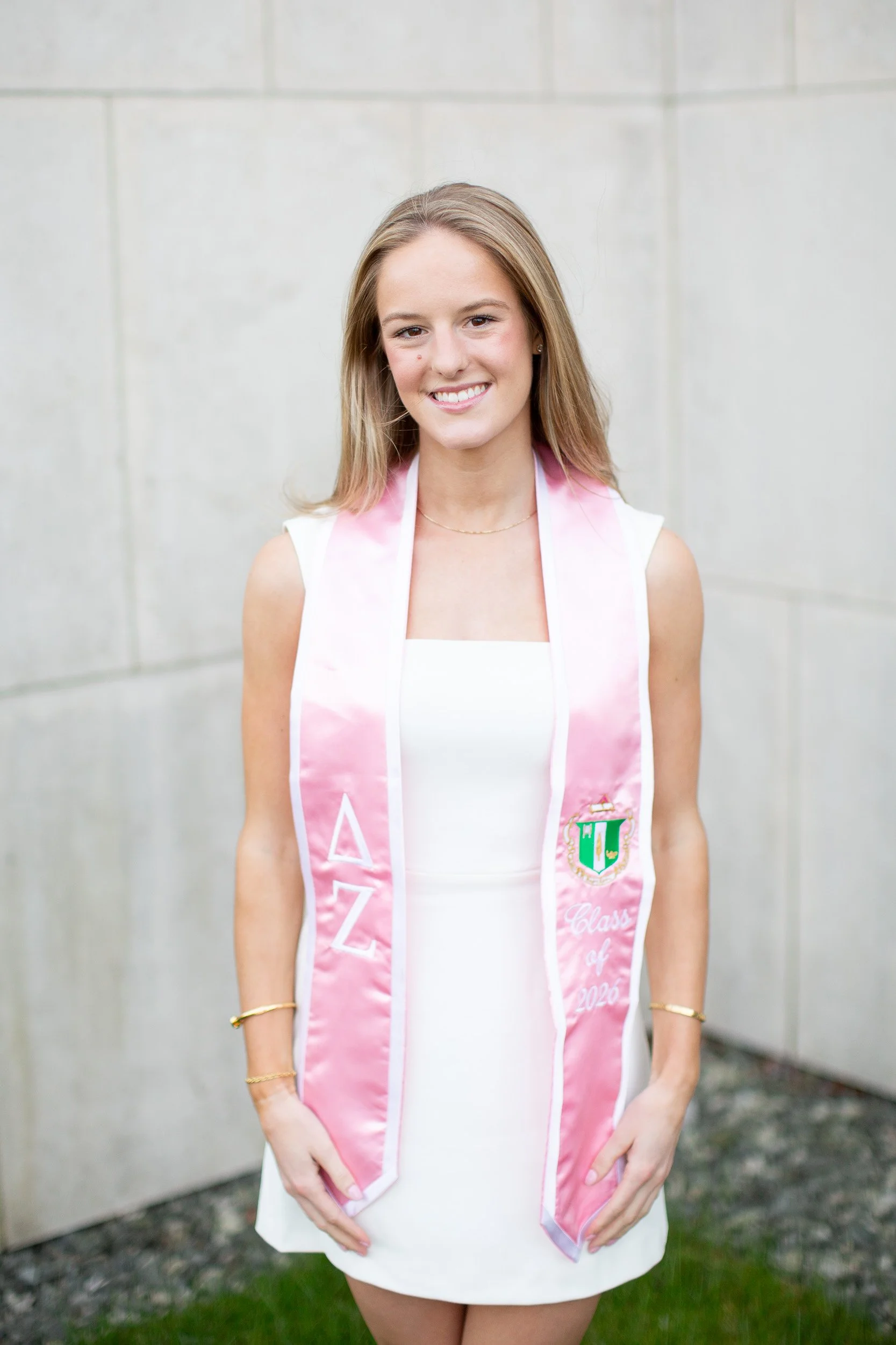 Bryant University graduate portrait session in Rhode Island wearing sorority sash