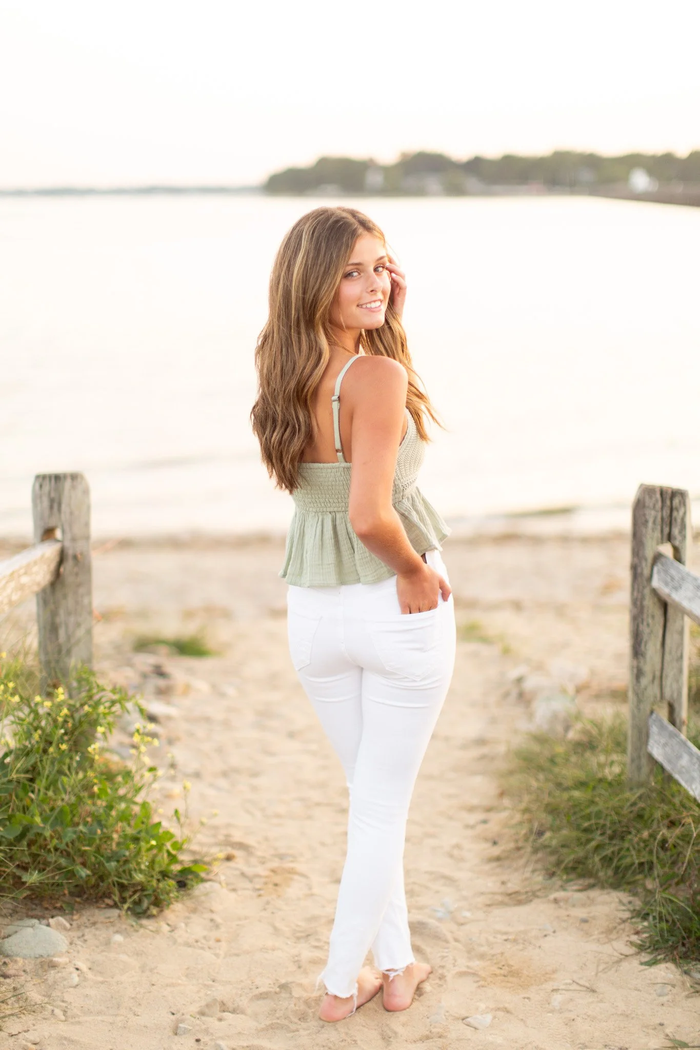 Sunset senior photos of Lily at Duxbury Beach with warm, coastal tones