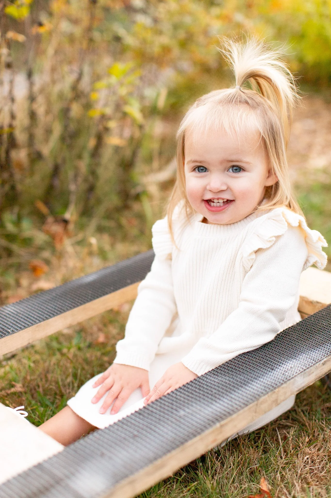 Toddler enjoying a relaxed family photo session at Adams Farm in Walpole MA