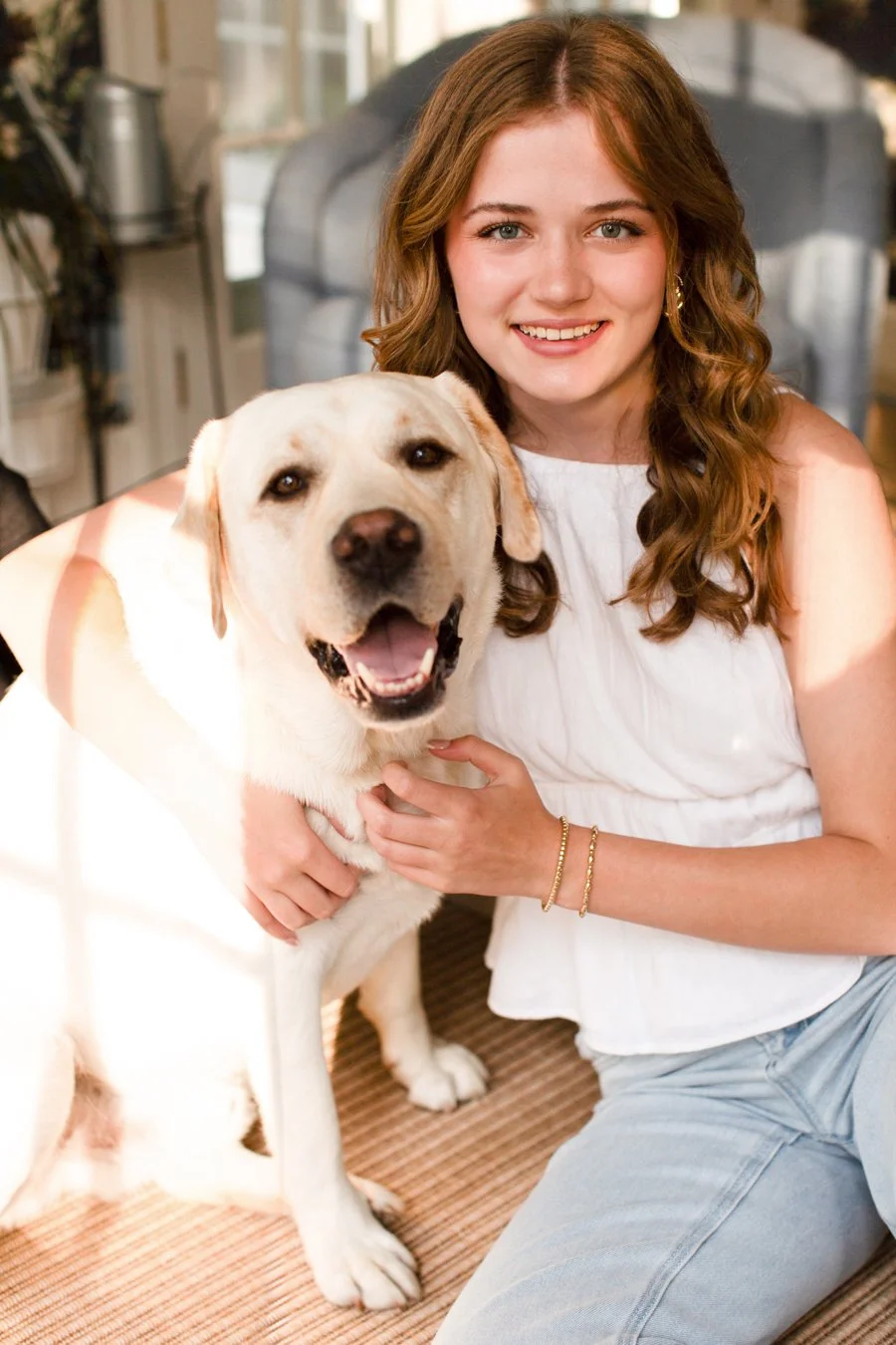 High school senior with her dog during a relaxed senior photo session in Milton