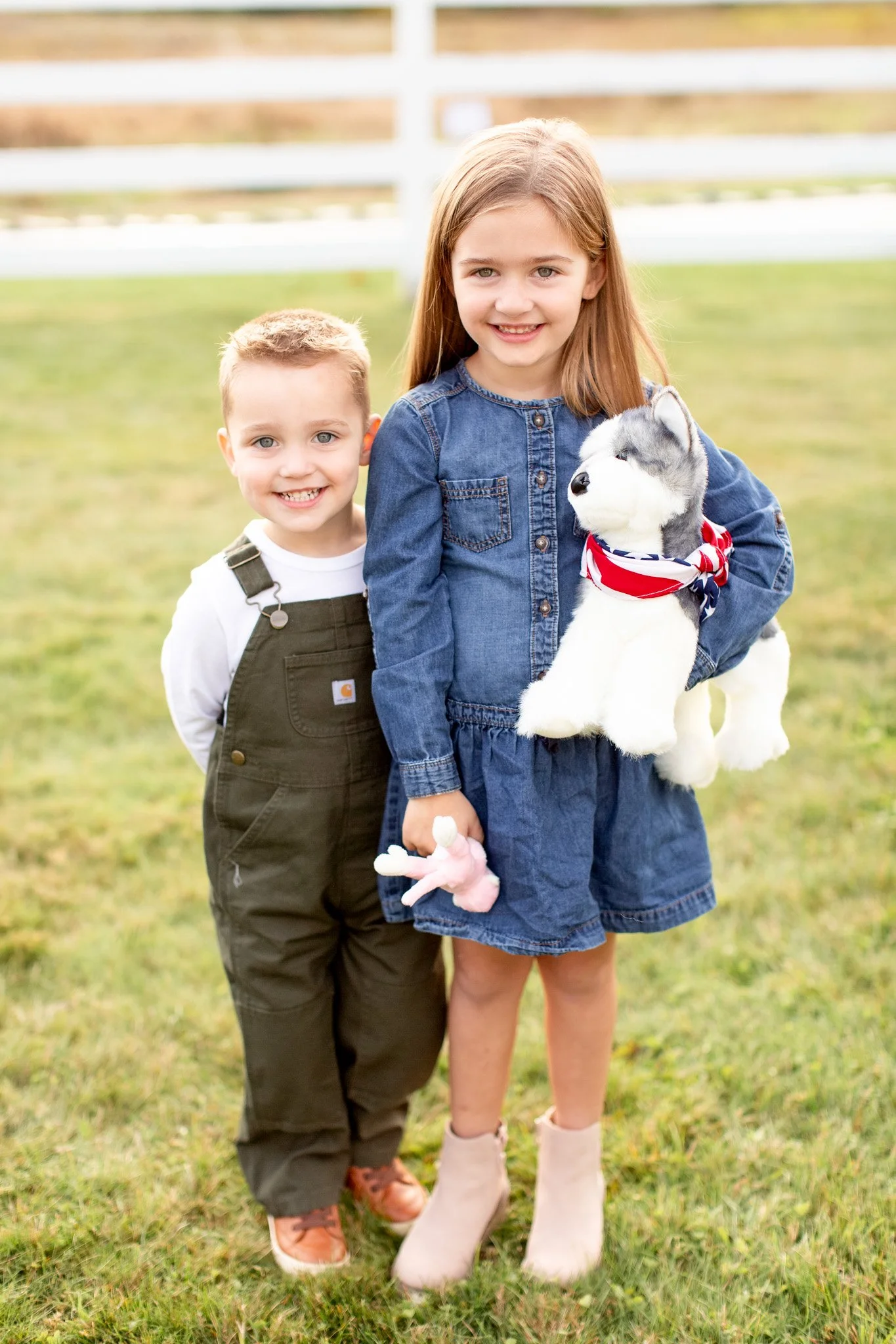 Kids laughing and exploring during a family photo session at Adams Farm in Walpole