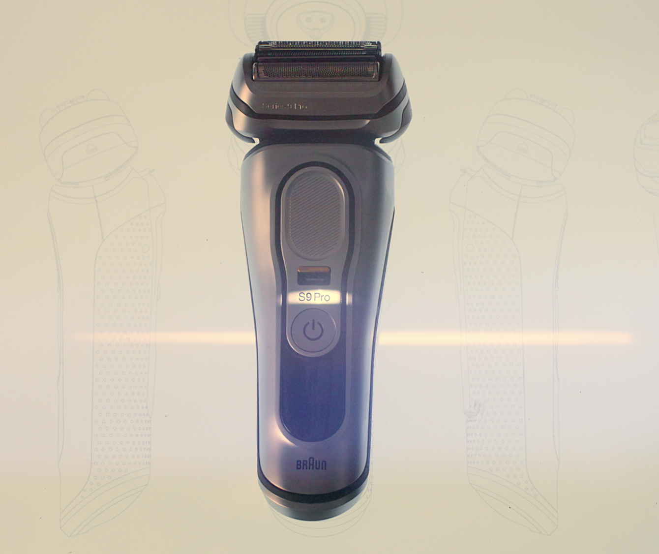 Electric shaver with a black and silver design, labeled S9 Pro, with a power button and a speaker grille, displayed on a light background with faint sketches of the same shaver on either side.