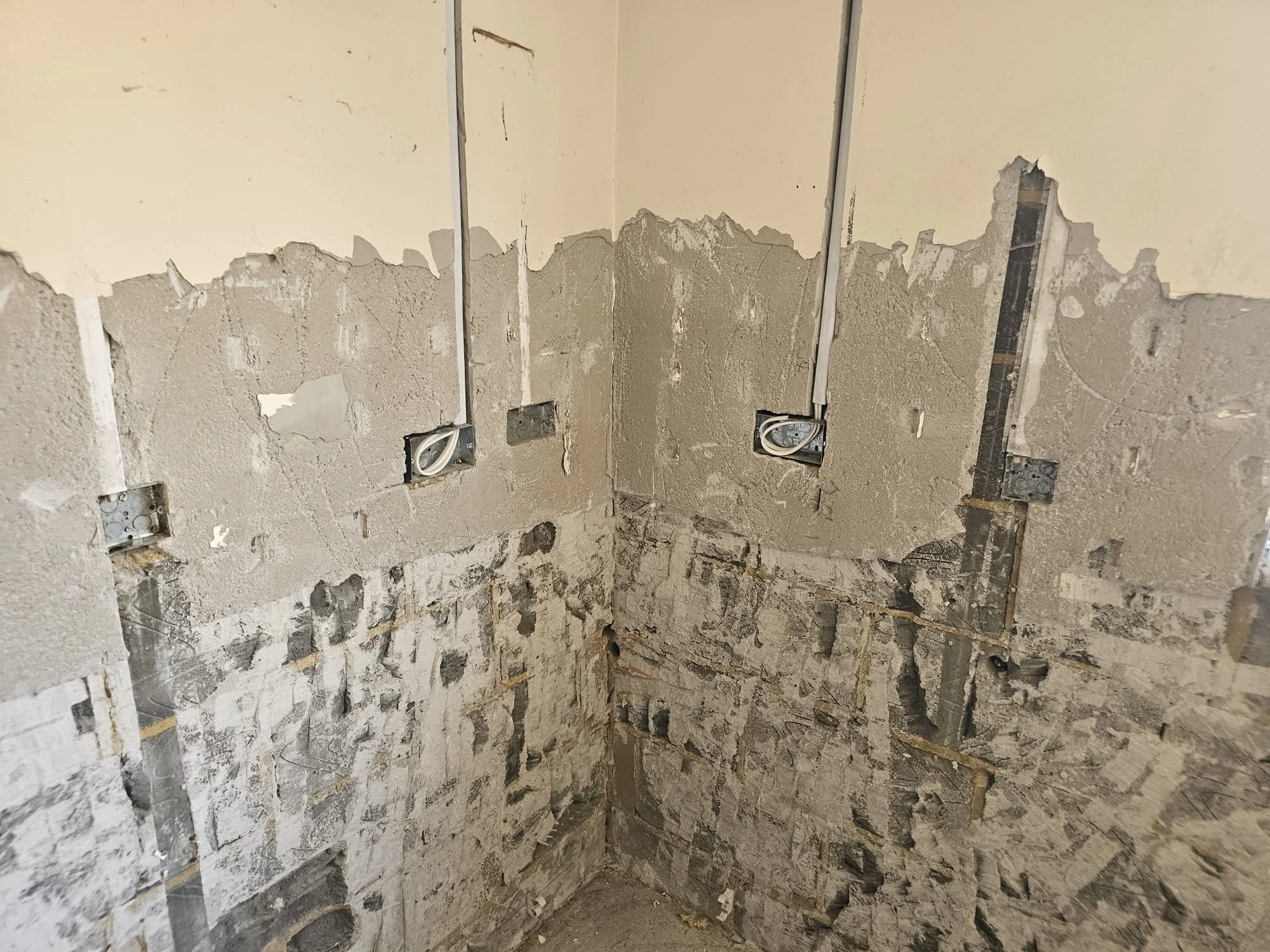 Wall prepared for rewiring with cable chases