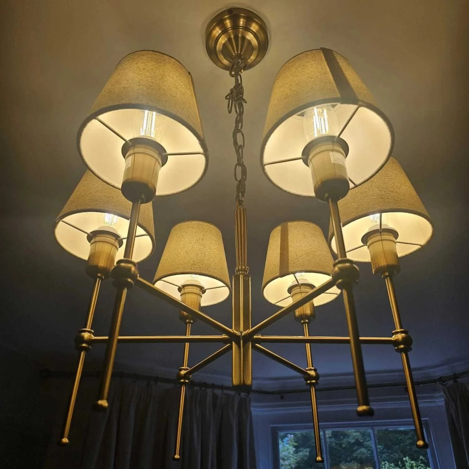 Ceiling chandelier with eight beige lampshades and metal rods, MS Electrical Solutions