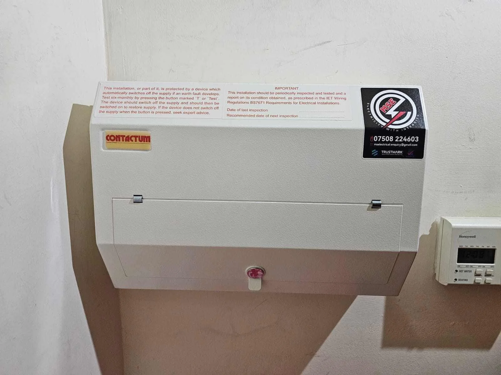 Electrical control panel mounted on a wall fitted by MS Electrical Solutions.