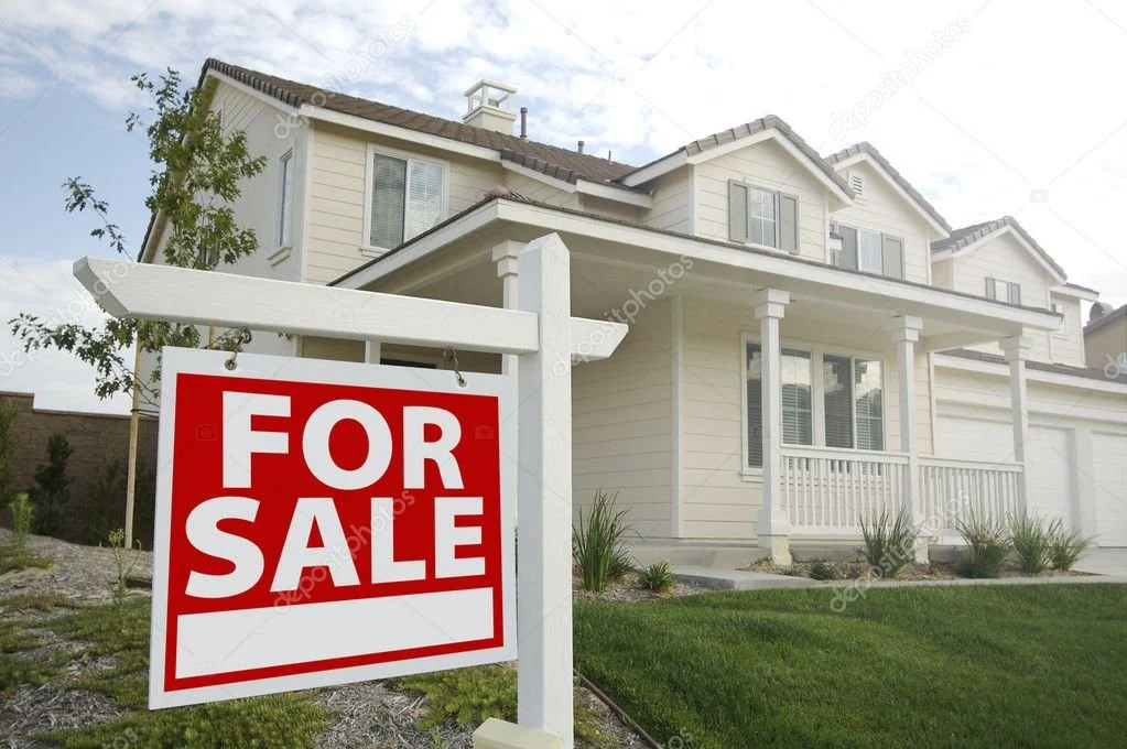 White house with a front porch and a