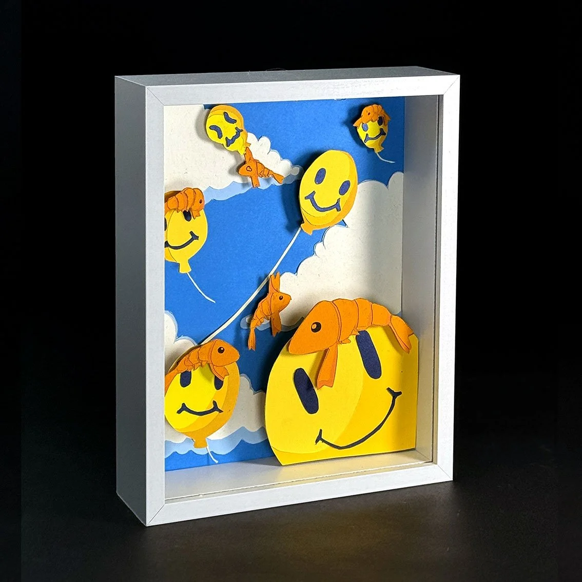 Papercut art of smiley face balloons with shrimp