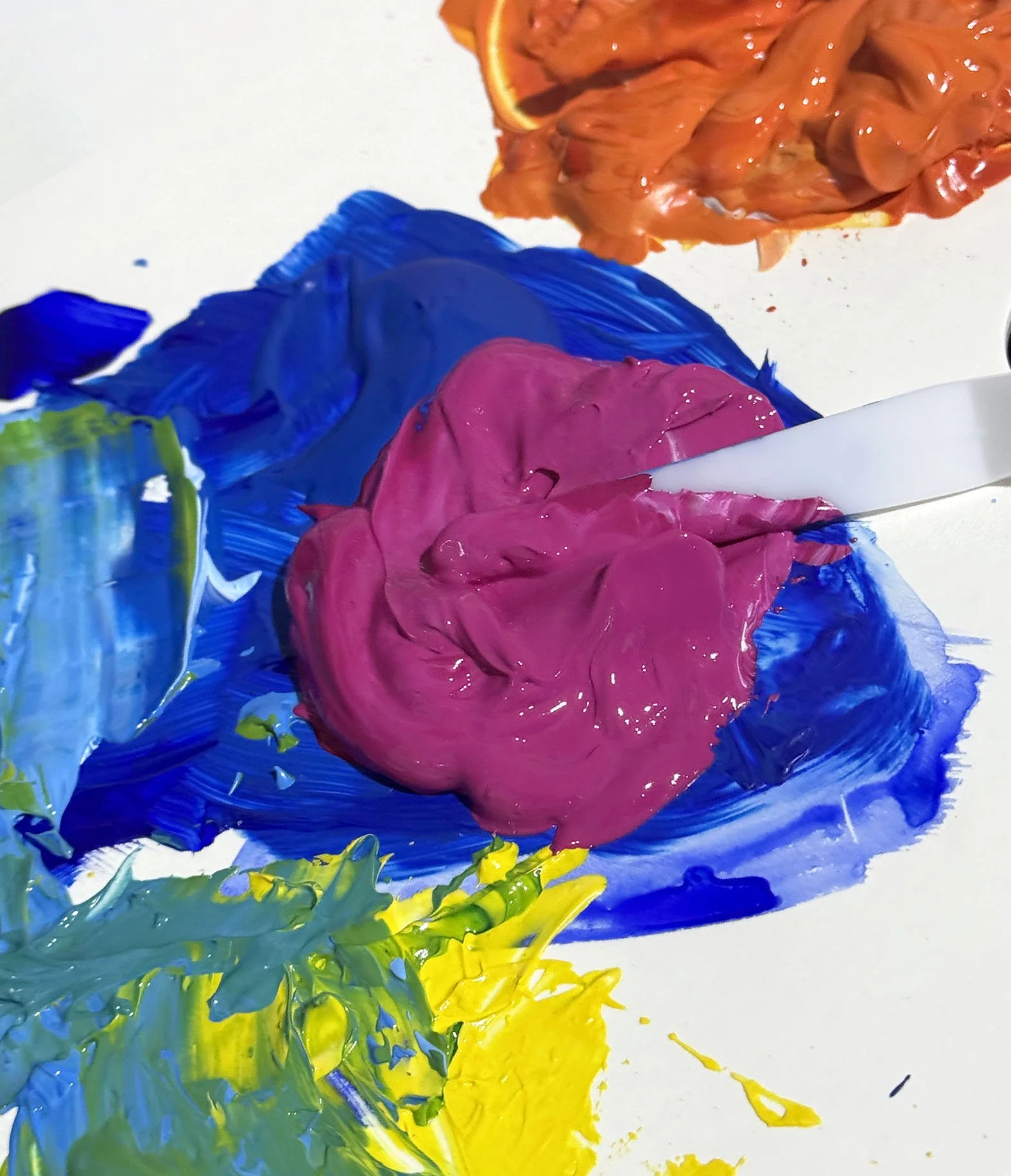 Vibrant colours of textured paint with a palette knife