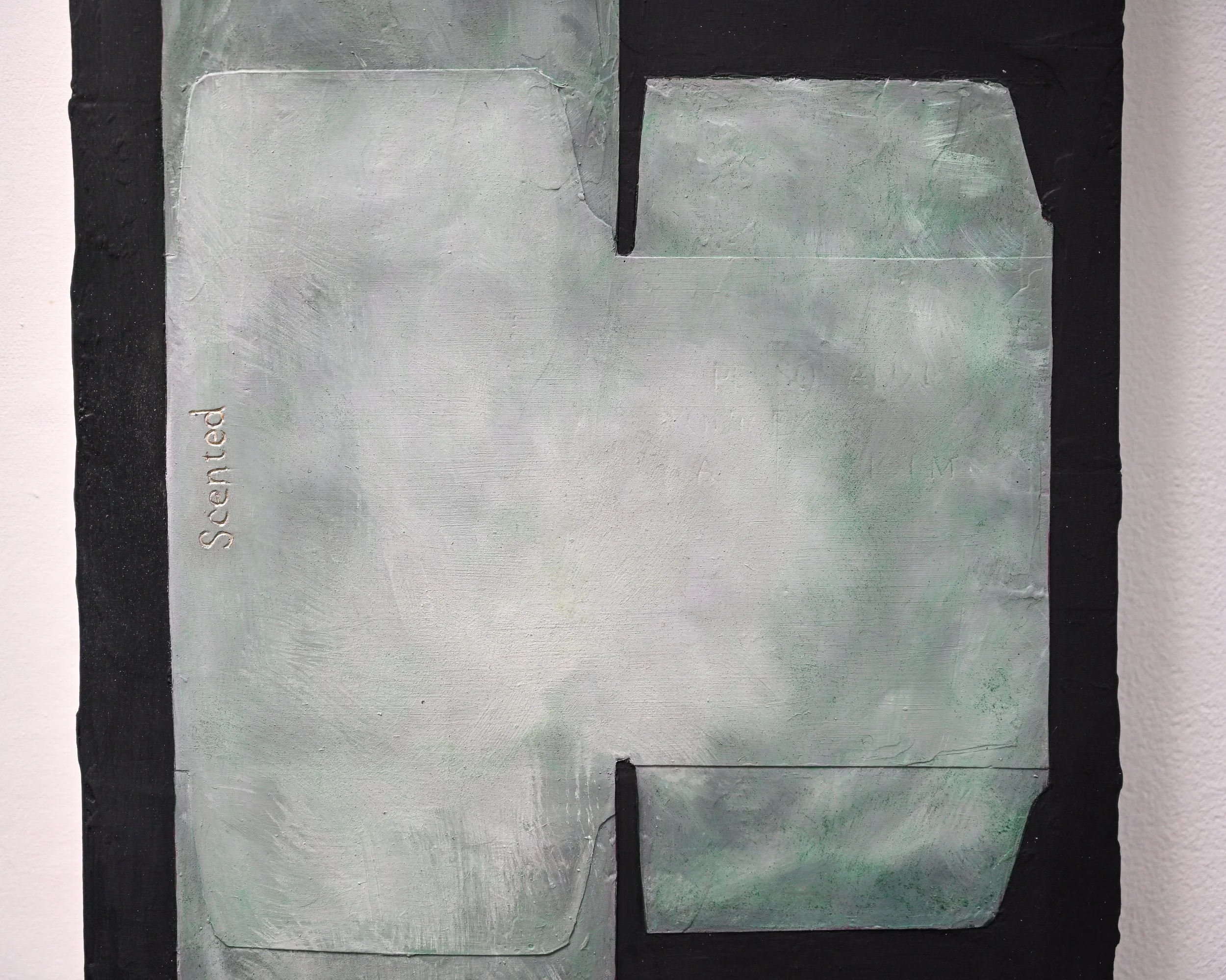 Close-up of a modern abstract painting with shades of gray, black, and hints of green, featuring geometric shapes and textured surface.
