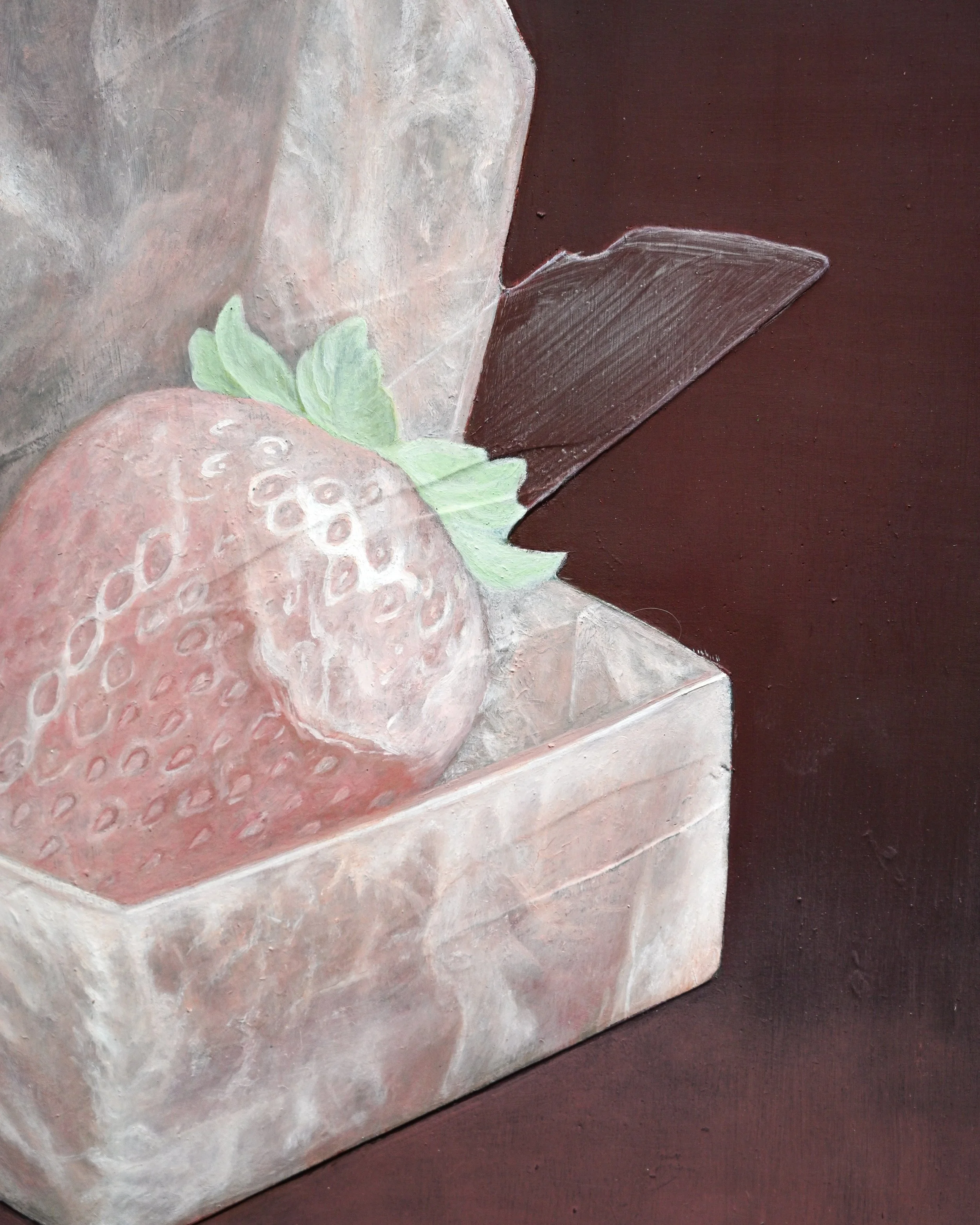 Close-up of a painted strawberry with green leaves on a textured surface.