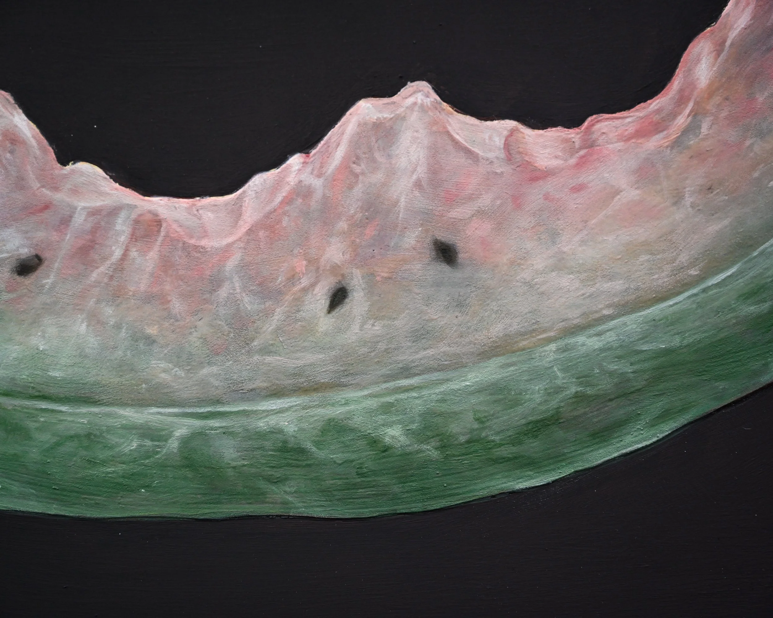 Close-up of a painted surface featuring mountains with pink and white hues, above a green layer and a black background.