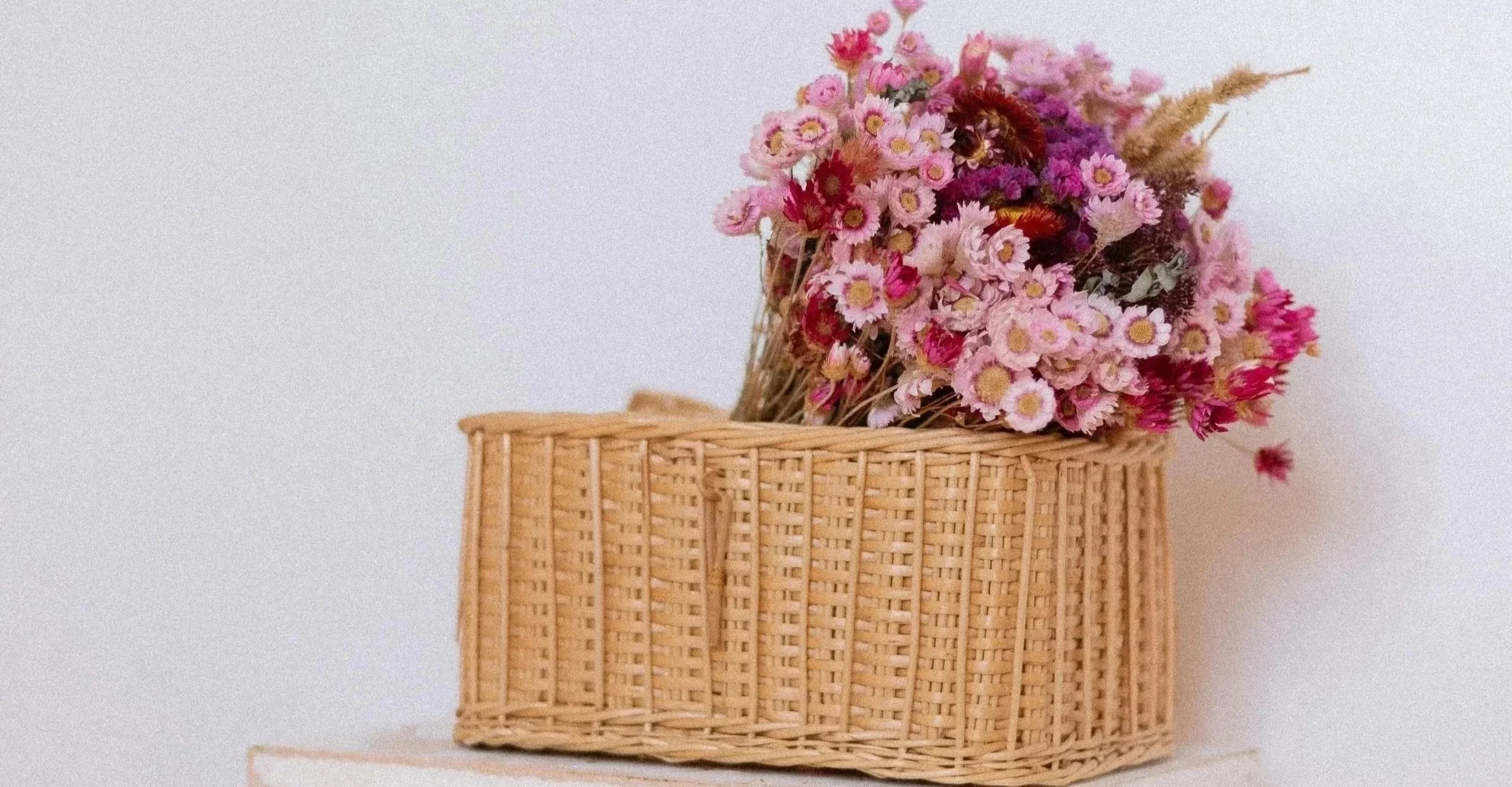 Bouquet of flowers in a box representing healing childhood wounds and self-compassion while processing resentment toward parents