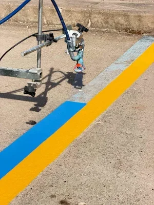 Parking lot striping in Williamstown WV with clean yellow lines improving safety, traffic flow, and parking organization.