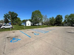 Parking lot striping in Parkersburg WV with clean yellow lines improving safety, traffic flow, and parking organization.
