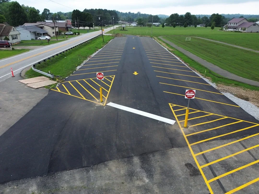 Steel pipe bollard installation completed at Kanawha Elementary School in Davisville WV to improve pedestrian safety and protect school entrances.