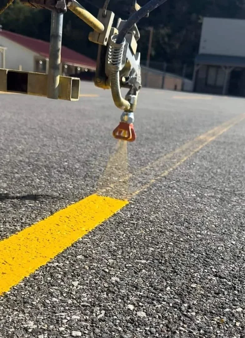 Parking lot line striping services in Parkersburg WV by Elite Pavement Maintenance for compliant and organized layouts.