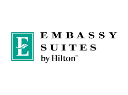 Embassy Suites by Hilton logo with stylized 'E' and text