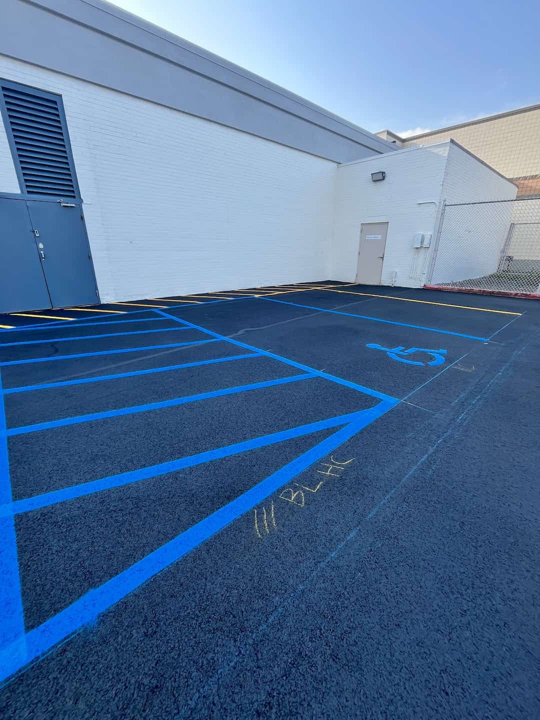 Fresh commercial parking lot striping installed at Grand Central Mall in Vienna WV with bright, highly visible pavement markings.
