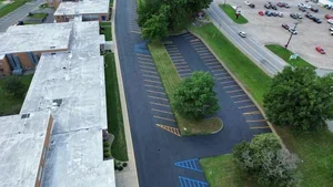 Parking lot sealcoating in Mineral Wells WV with fresh black asphalt finish protecting pavement from weather and traffic damage.