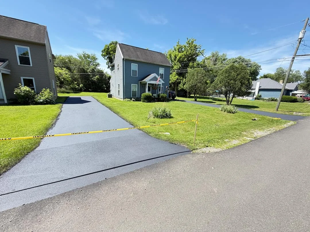 driveway sealing project in Athens OH helping protect asphalt from weather and cracking.