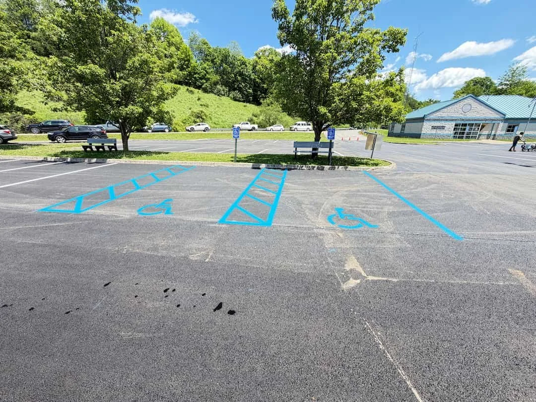 Chalk line preparation for commercial parking lot striping project in Clarksburg WV.
